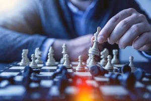 What is Business Networking and Its Benefits and strategies? Man playing chess